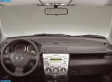 Ð“Ð°Ð»ÐµÑ€ÐµÑ Ñ„Ð¾Ñ‚Ð¾Ð³Ñ€Ð°Ñ„Ð¸Ð¹ Ð¸ Ð¾Ð±Ð¾ÐµÐ² Ñ€Ð°Ð±Ð¾Ñ‡ÐµÐ³Ð¾ ÑÑ‚Ð¾Ð»Ð° Ñ Ð¸Ð·Ð¾Ð±Ñ€Ð°Ð¶ÐµÐ½Ð¸ÐµÐ¼ ÑÐºÑÑ‚ÐµÑ€ÑŒÐµÑ€Ð°, Ð¸Ð½Ñ‚ÐµÑ€ÑŒÐµÑ€Ð°, ÐºÐ¾Ð½ÑÑ‚Ñ€ÑƒÐºÑ†Ð¸Ð¸ Ð¸ Ð´Ð¸Ð·Ð°Ð¹Ð½ÐµÑ€ÑÐºÐ¸Ñ… Ñ€Ð¸ÑÑƒÐ½ÐºÐ¾Ð² Ð°Ð²Ñ‚Ð¾Ð¼Ð¾Ð±Ð¸Ð»Ñ 2003 Mazda 2.